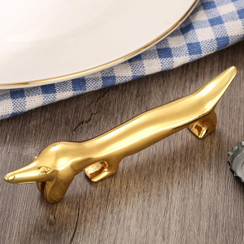 LULLEA Dackel-Flaschenöffner und Messerbänkchen, goldfarben